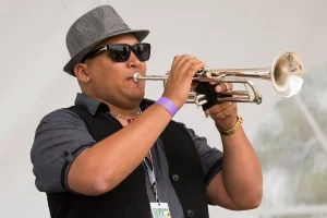 Lazaro plays trumpet with Kekoson Cuban Sounds